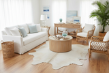 white cowhide rug stage in a beach home