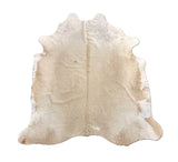 beige cowhide rug