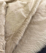 beige cowhide rug