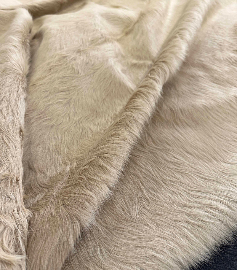 beige cowhide rug
