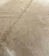 beige cowhide rug