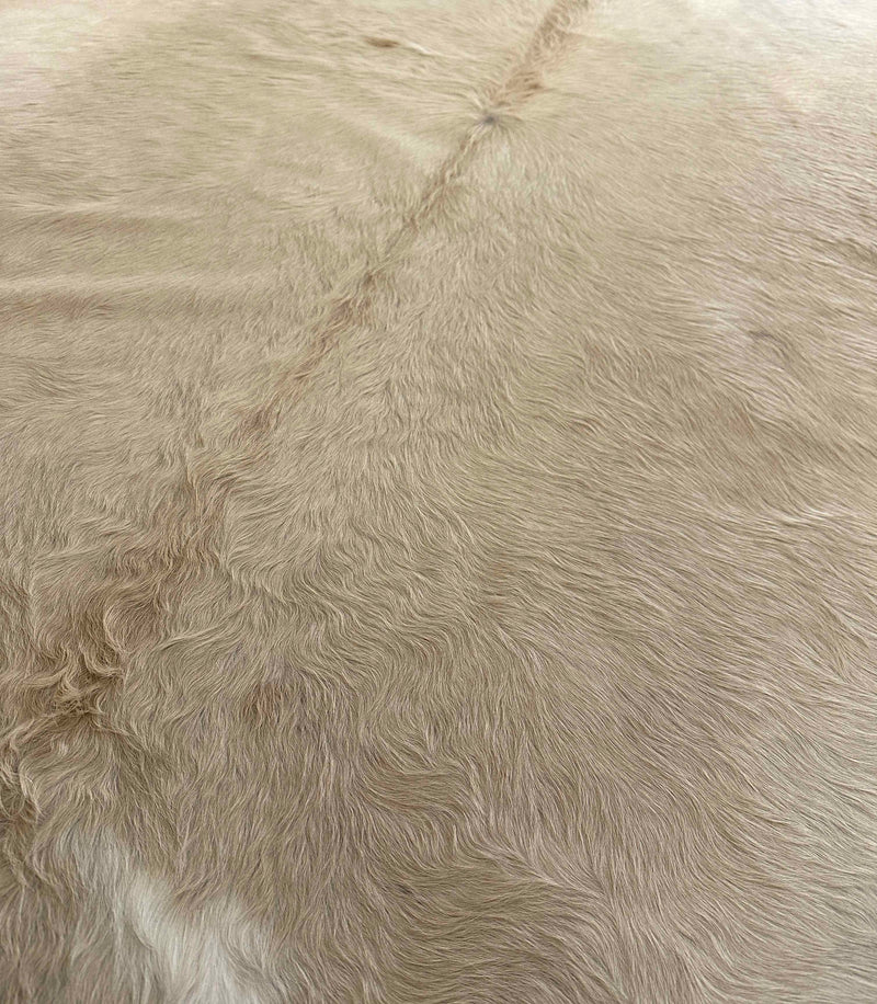 beige cowhide rug