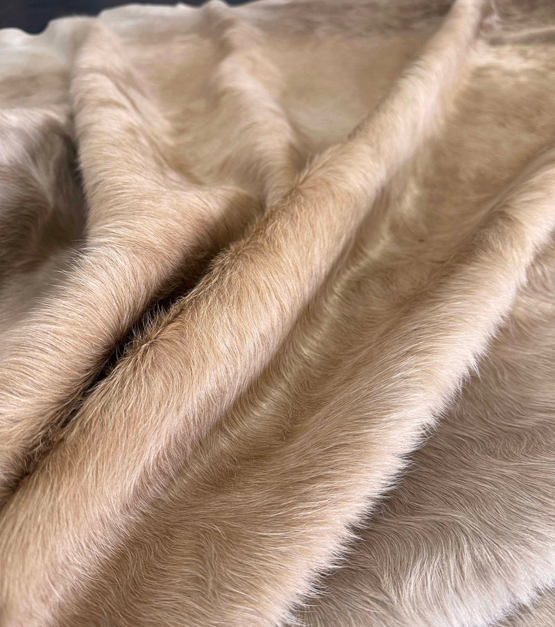 beige cowhide rug