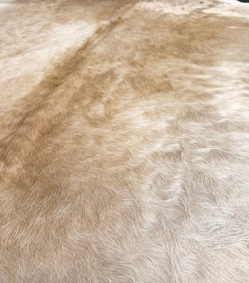 beige cowhide rug
