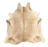 Beige cowhide rug on a white background