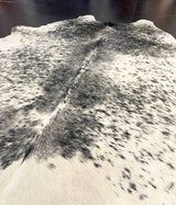 Close-up of a cowhide rug with black and white pattern
