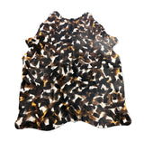 stenciled black cowhide rug