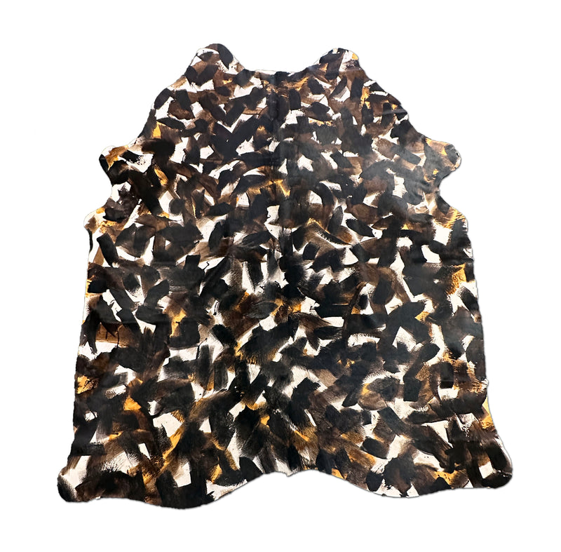 stenciled black cowhide rug