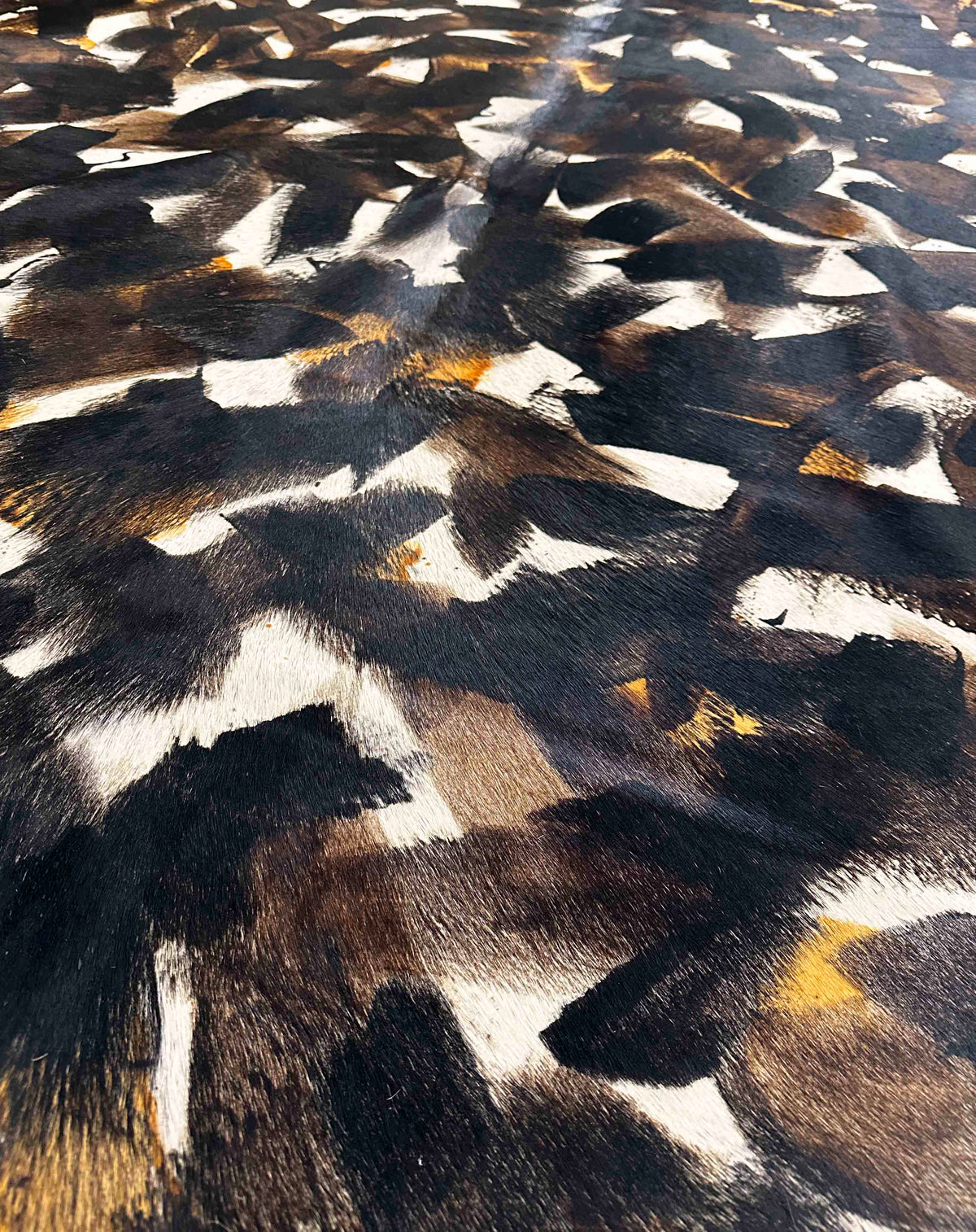 stenciled black cowhide rug