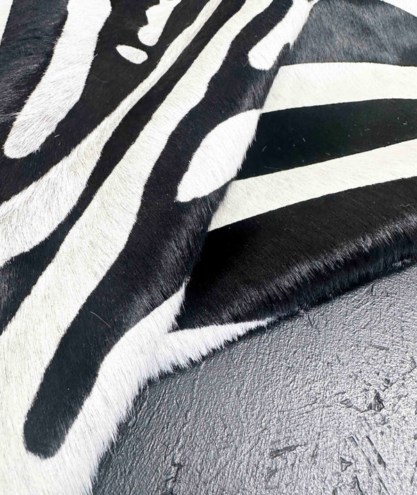 Stenciled Zebra On White Cowhide Rug