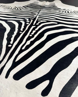 Stenciled Zebra On White Cowhide Rug