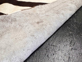 Stenciled Brown Zebra On White Cowhide Rug