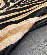 stenciled zebra cowhide rug