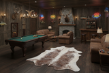 tri-color cowhide rug in a man cave