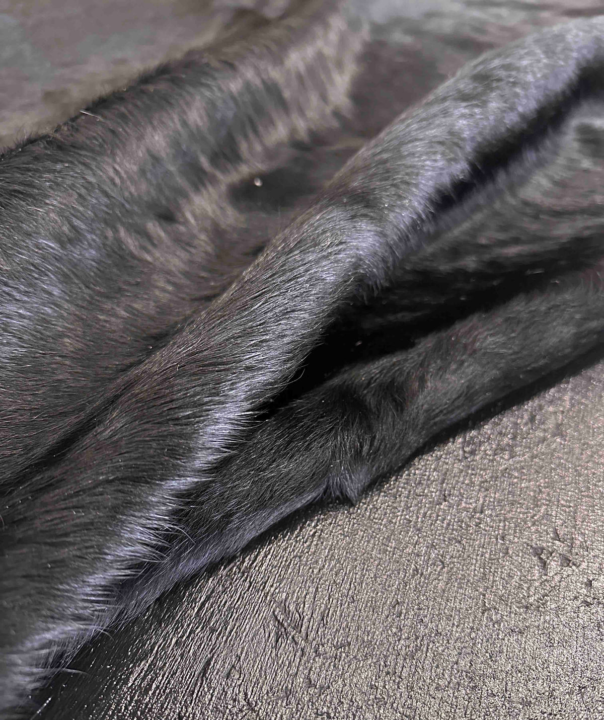 close-up of a black cowhide rug