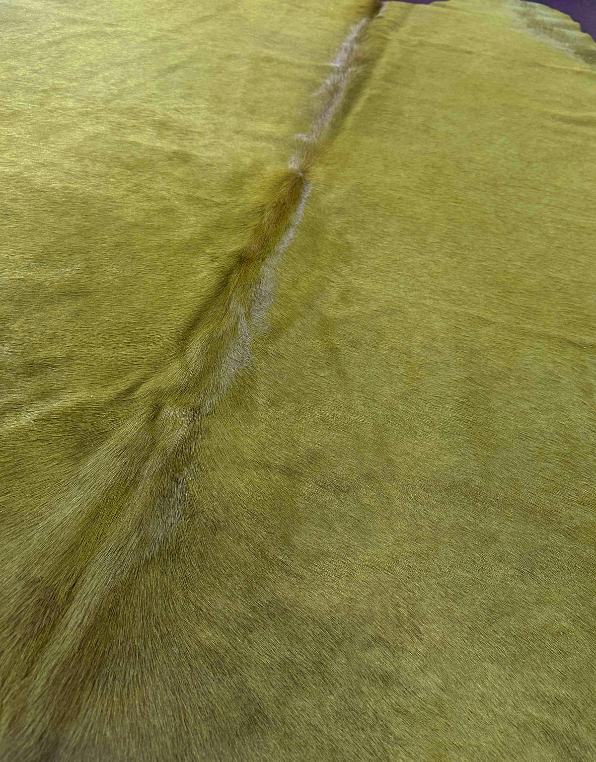dyed green cowhide rug