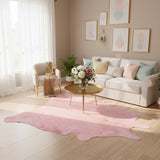 pink cowhide rug staged in living room