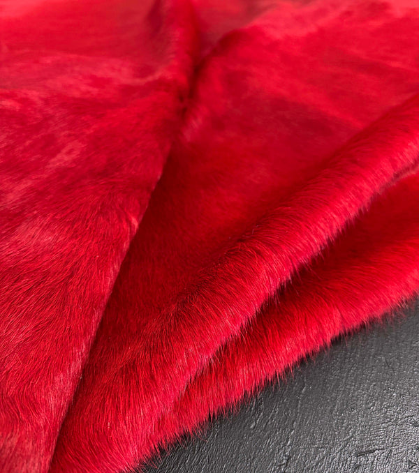 red cowhide rug