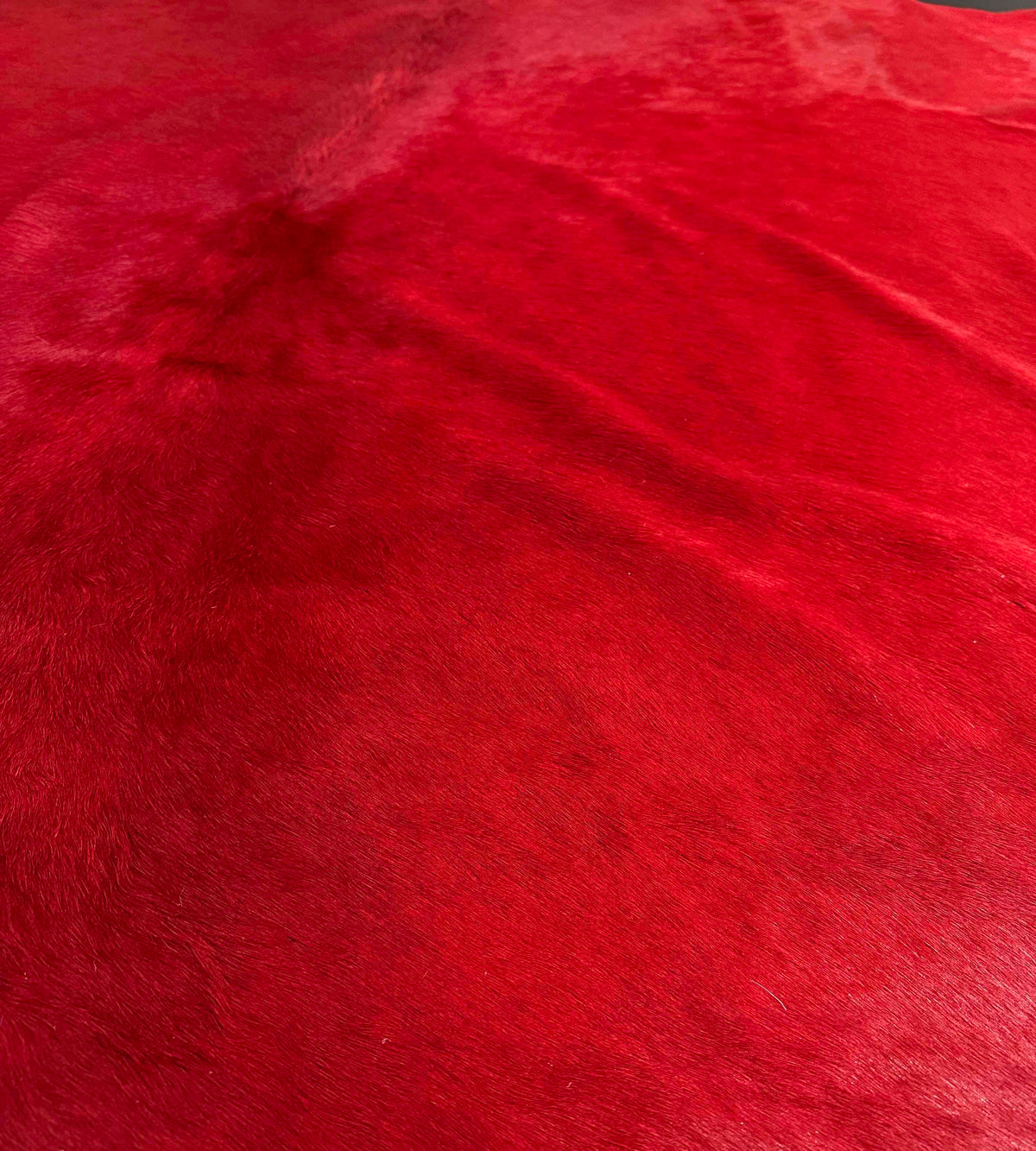 red cowhide rug