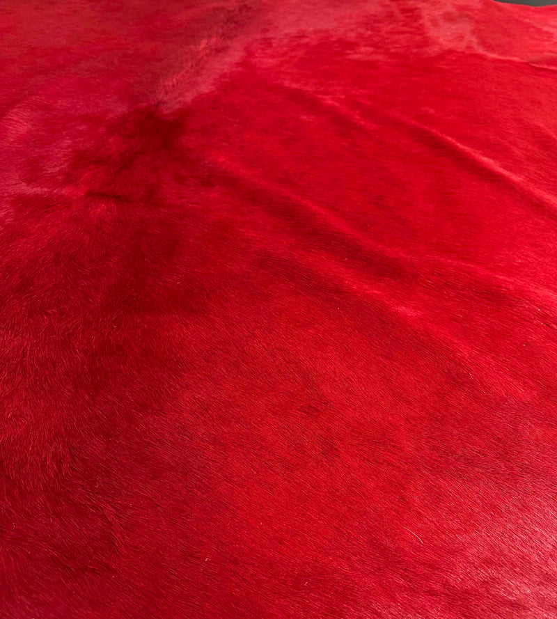 red cowhide rug
