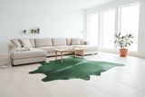 green cowhide rug in living room