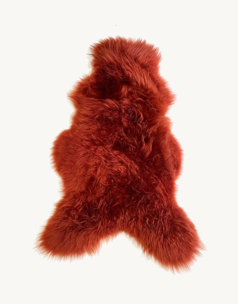 red sheepskin rug