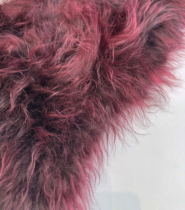 red sheepskin rug