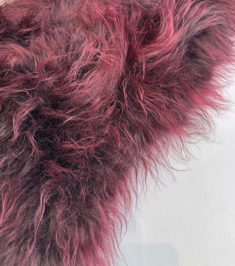 red sheepskin rug
