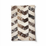 Palermo 16-by-24-inch stitched cowhide rug sample in an ivory, cream and stonewashed brown geometric pattern