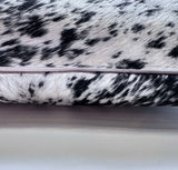 Natural salt and pepper cowhide pillow detail with hidden zipper closure