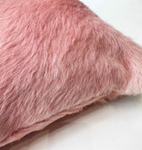 Close-up of enchant pink cowhide pillow showing natural hair texture