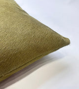 Close-up of Moss green cowhide pillow showing natural hair-on-hide texture