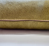 Moss green cowhide pillow detail with hidden zipper closure
