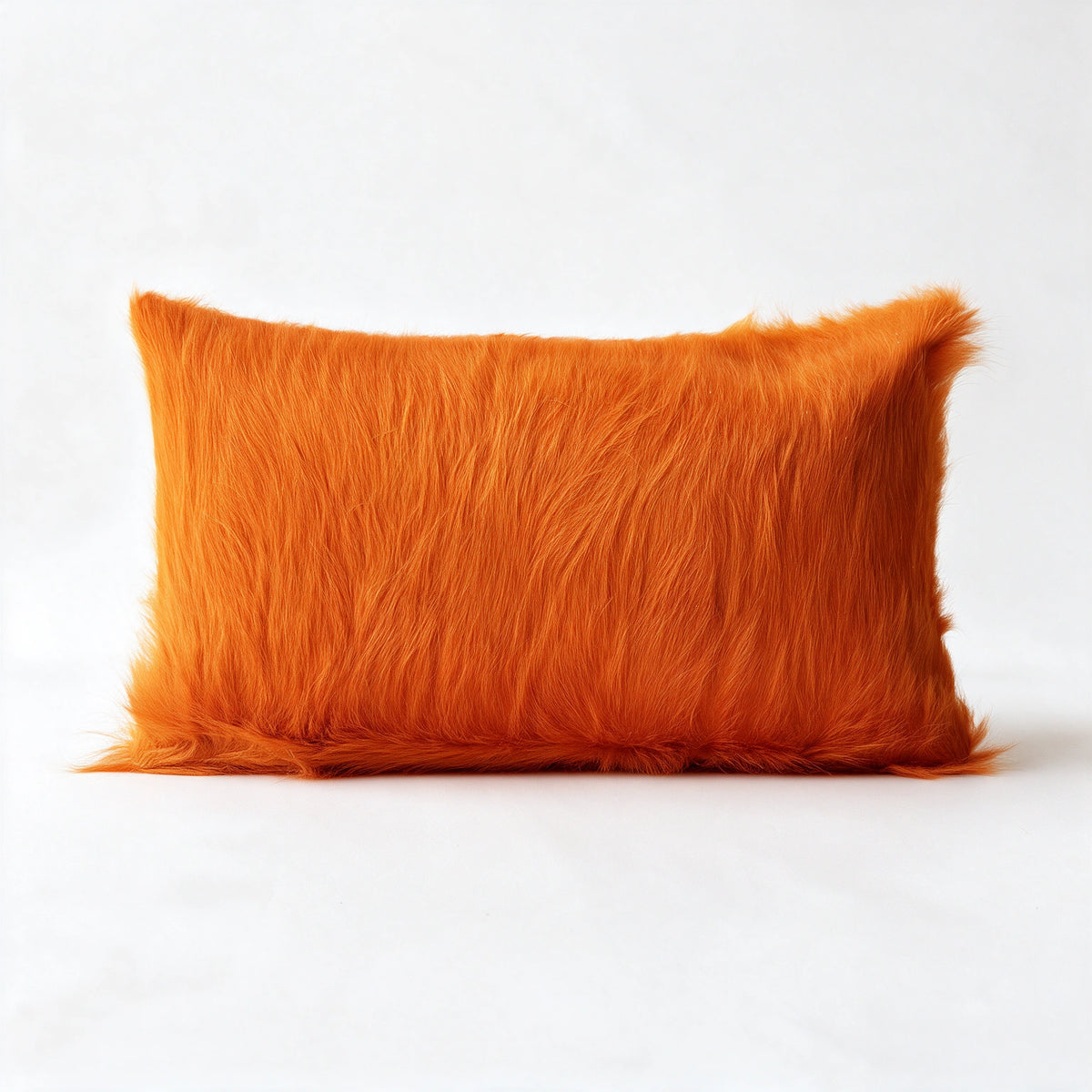 Valencia orange cowhide lumbar pillow in 12 x 20 size