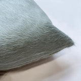 Close-up of Sea Glass blue cowhide pillow showing natural hair-on-hide texture