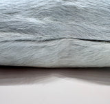 Close-up of Sea Glass blue cowhide pillow zipper showing natural hair-on-hide texture