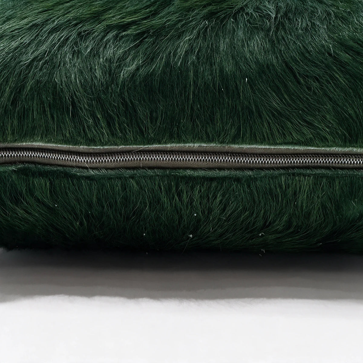 Shamrock green cowhide pillow detail with hidden zipper closure