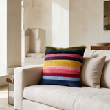 Chromata multicolor stitched cowhide pillow in a staged living room