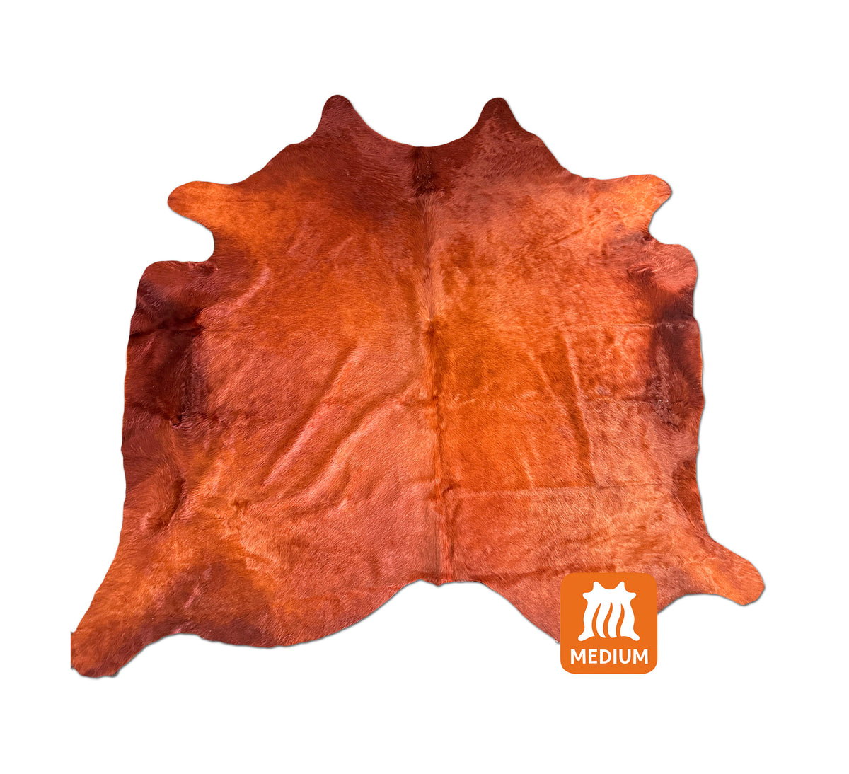 Terracotta dyed cowhide rug with burnt-orange and deep rust tones, shown in full