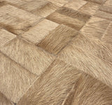 Close-up of Tessaro rectangular cowhide pieces with varied hair direction and coordinating zigzag stitching
