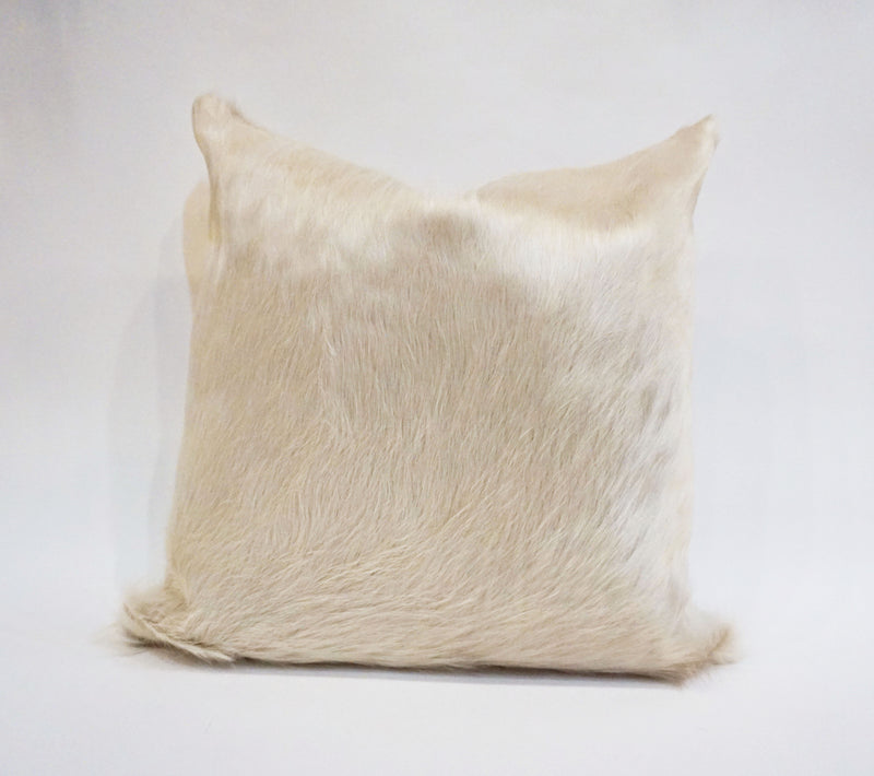 white cowhide pillow