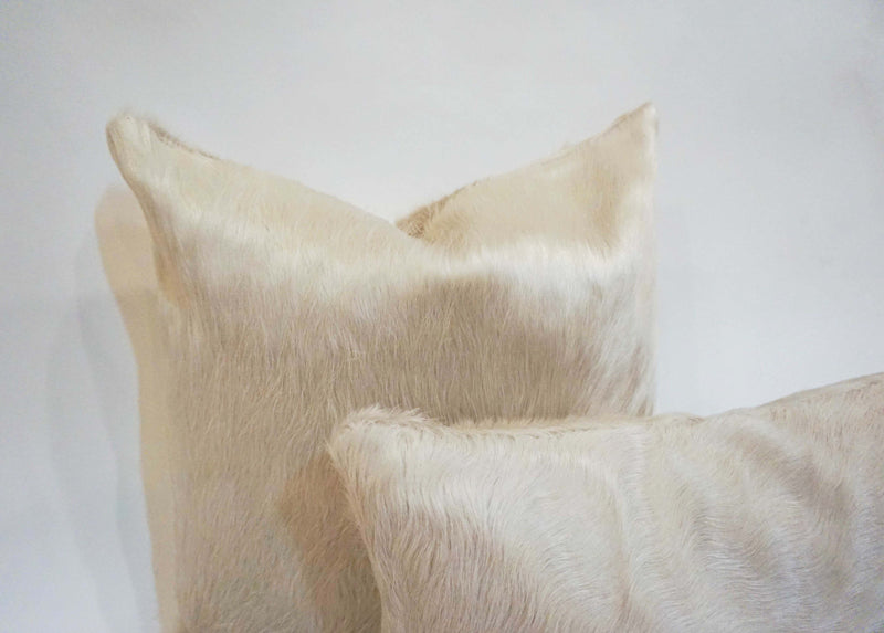 white cowhide pillow