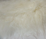 white sheepskin fur rug
