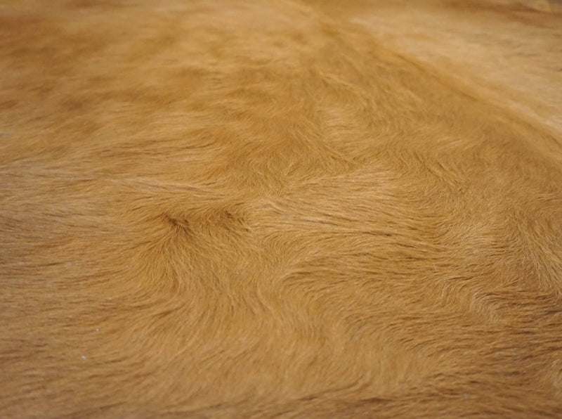 brown cowhide rug