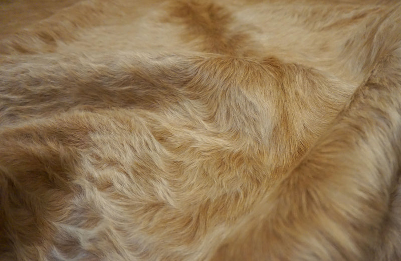 brown cowhide fur rug