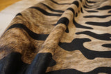 stenciled tiger cowhide rug