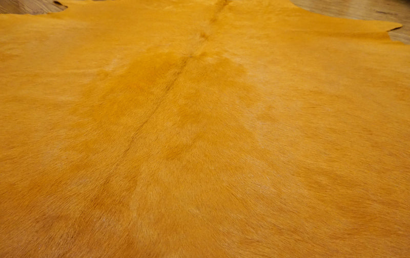 dyed Hermes orange cowhide rug