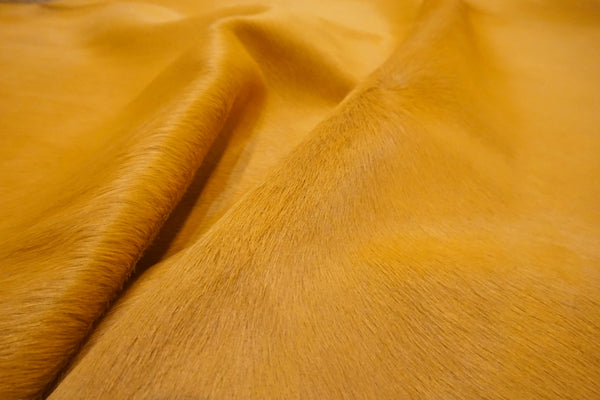 dyed Hermes orange cowhide rug