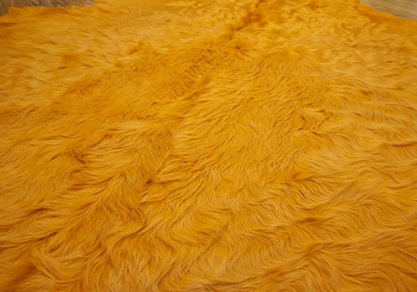 dyed Hermes orange cowhide rug